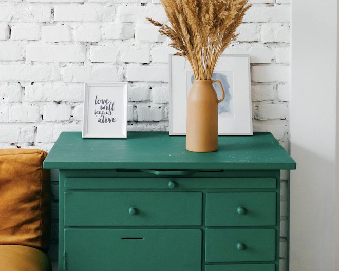 A green drawer with decorations on it.